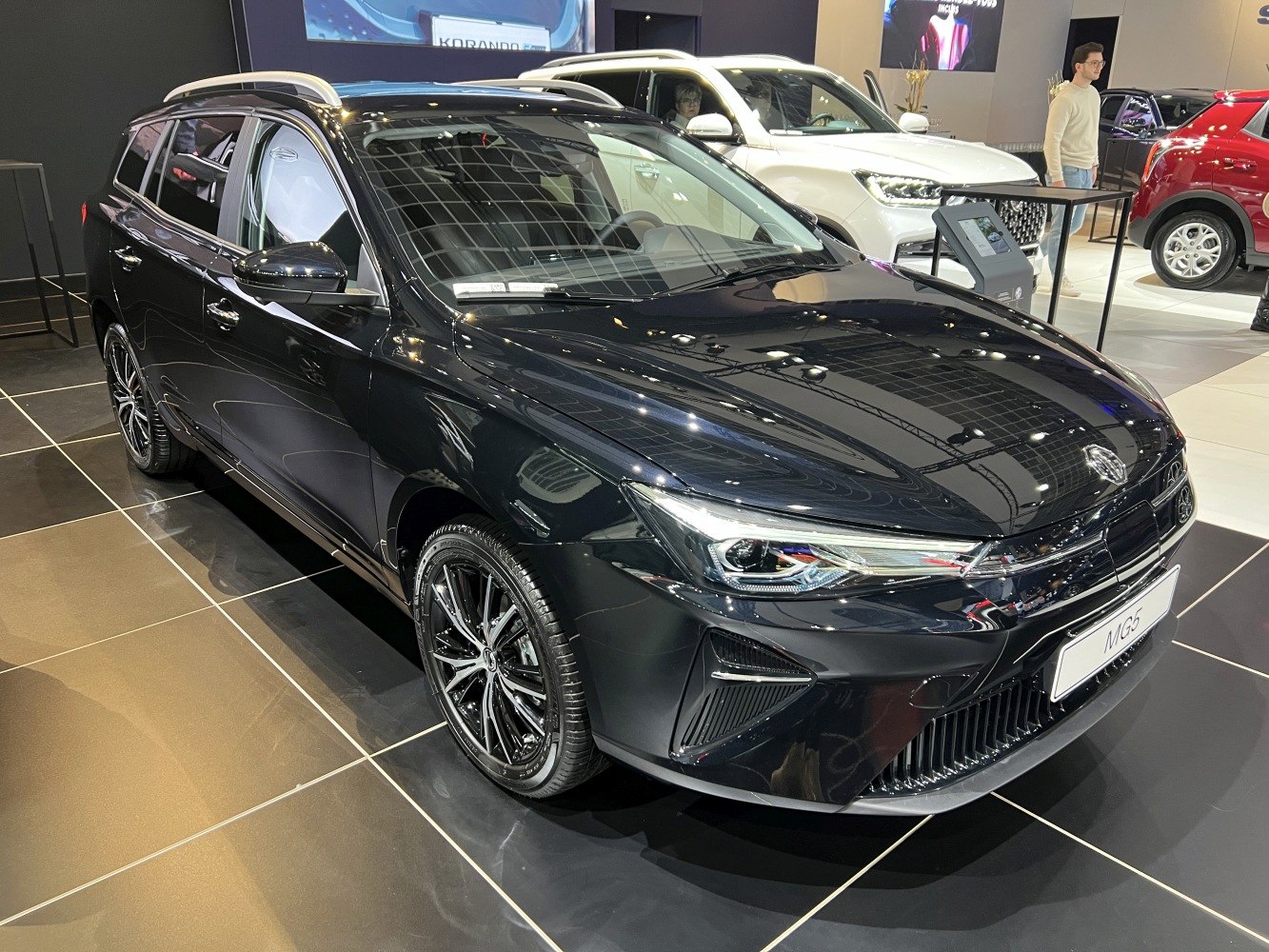 Sleek car front with modern LED headlights and sporty alloy wheels.