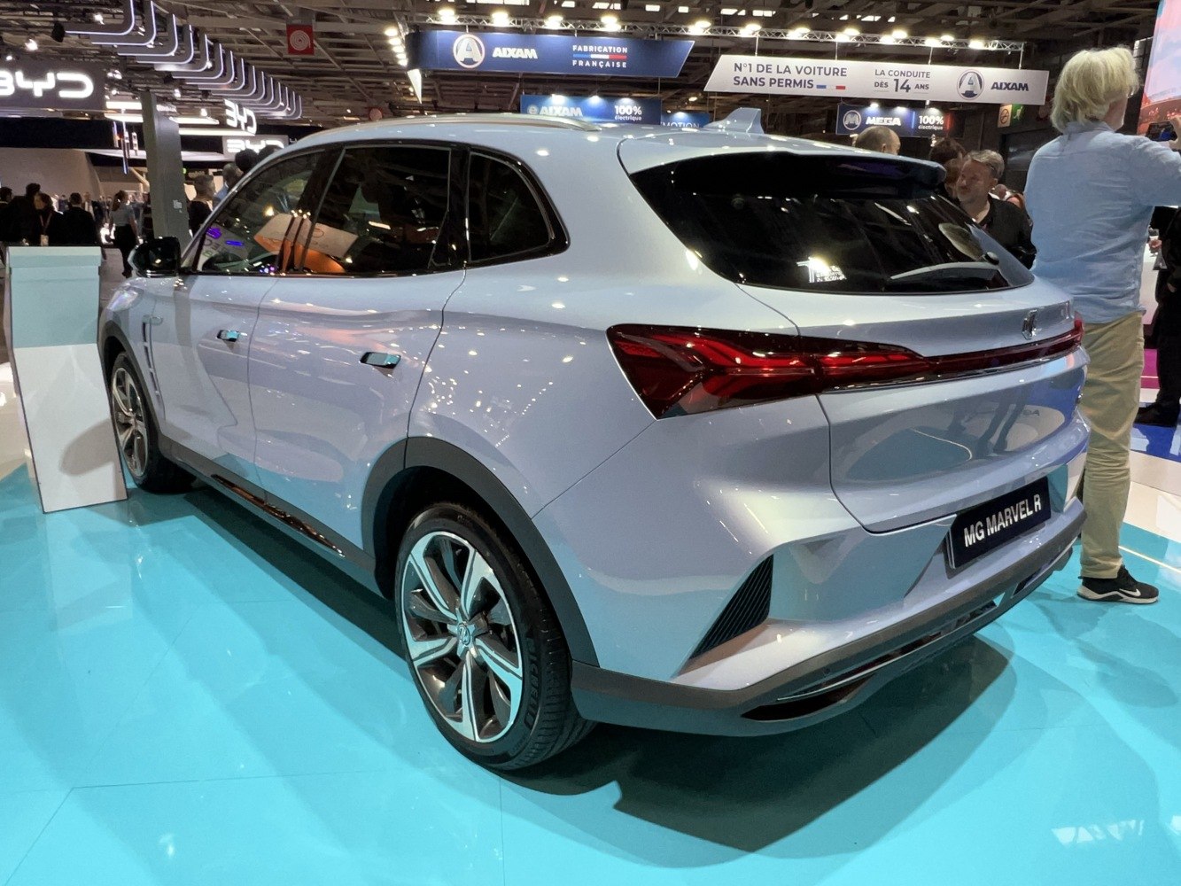 Sleek electric SUV rear and side with continuous tail light and aerodynamic design
