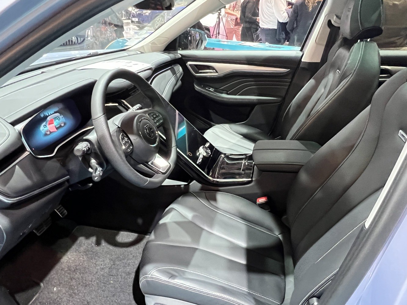 Digital dashboard and black leather front seats with touchscreen console.