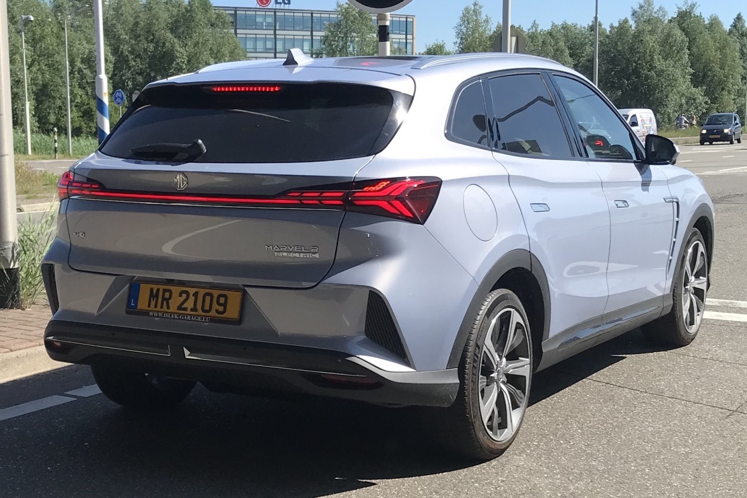 Rear view of a modern electric SUV with distinctive LED taillights.