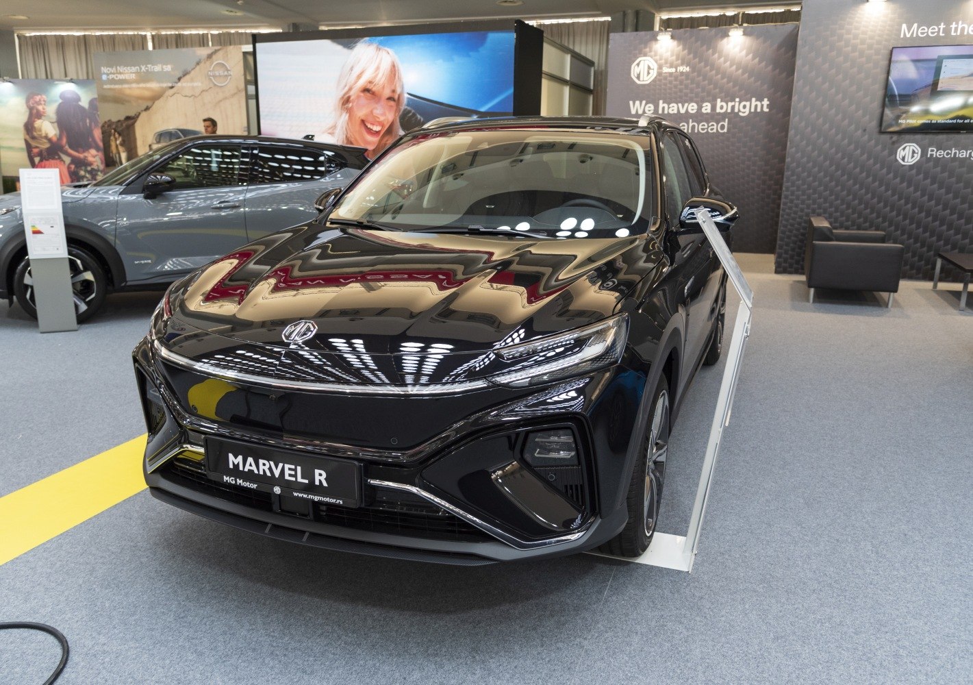 Front view of modern MG electric SUV with sleek LED headlights and bold grille.