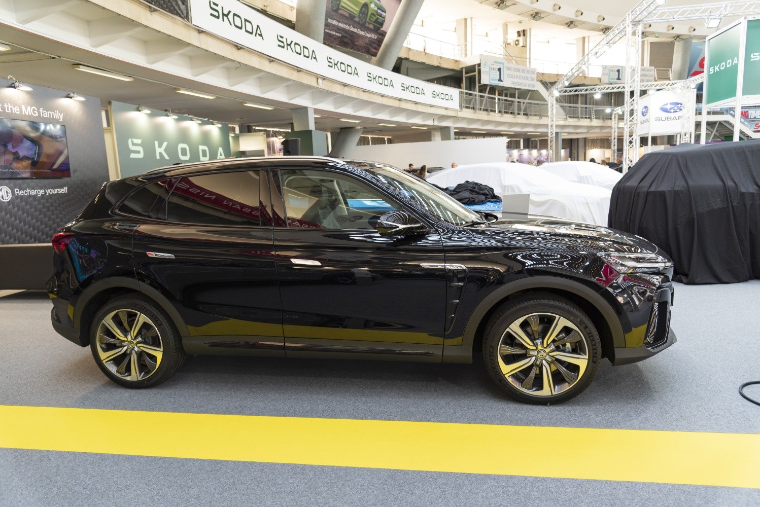 Sleek black SUV side profile with distinctive alloy wheels