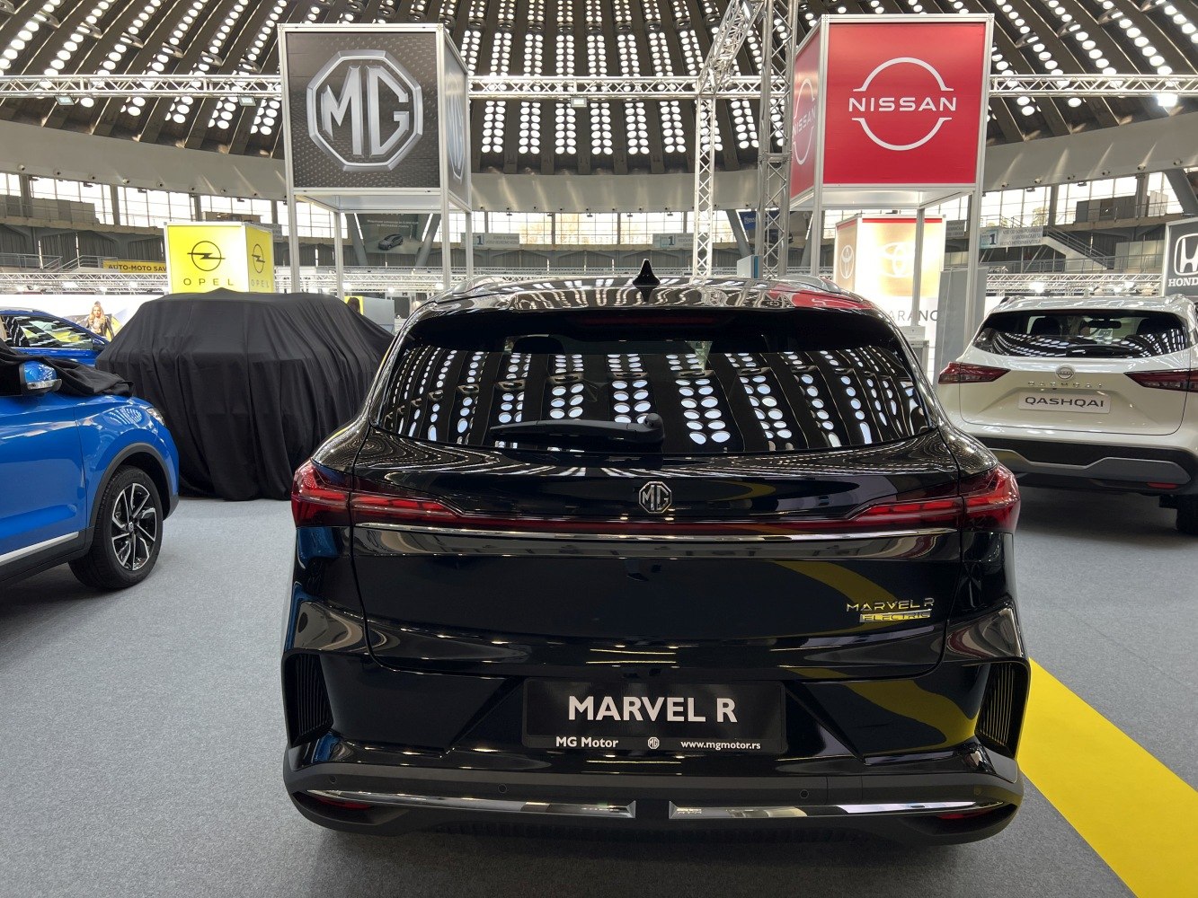 Rear view of sleek electric SUV with modern taillights and aerodynamic design