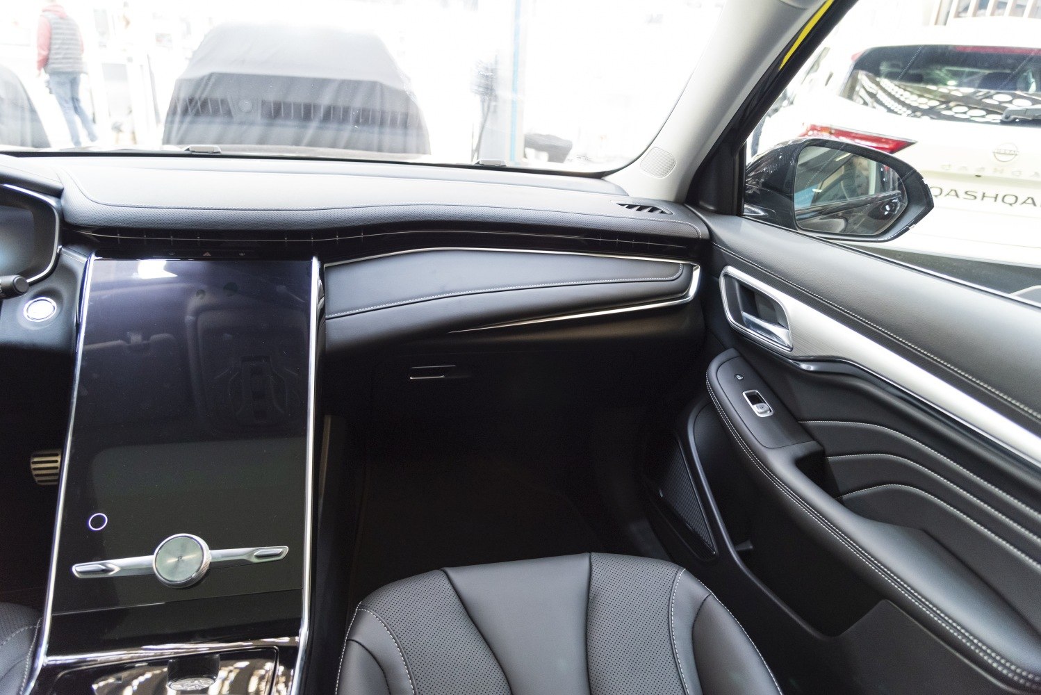 Large central touchscreen and premium modern interior design.
