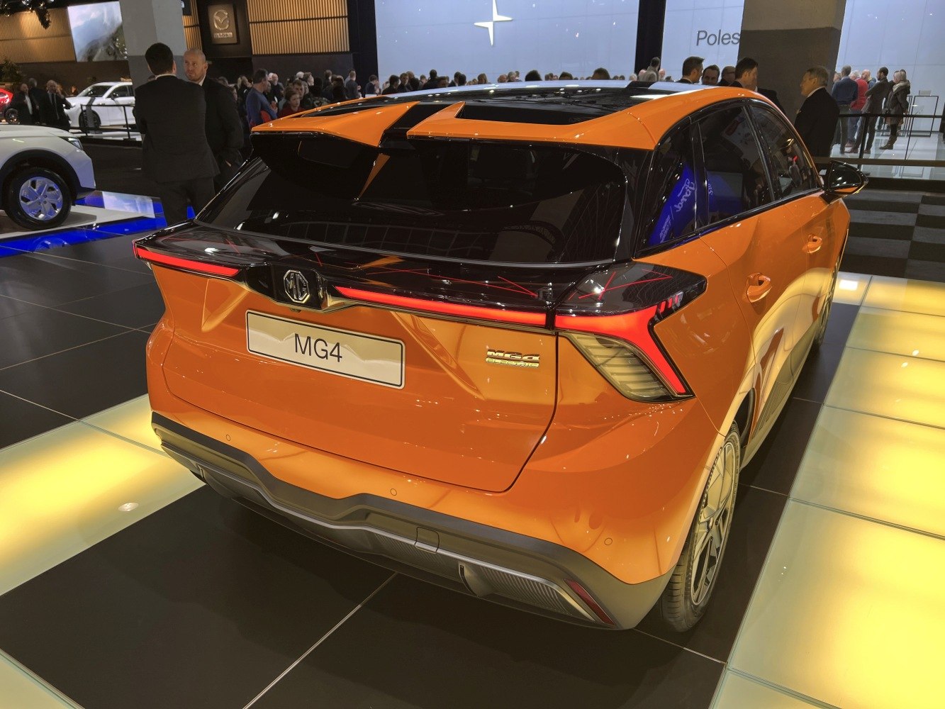 Rear view of electric hatchback with distinctive L-shaped taillights and bold design.