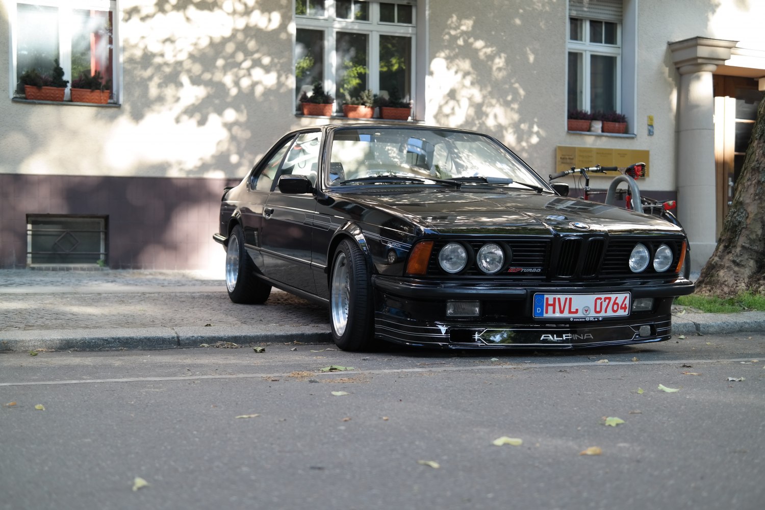 Classic car front view with quad round headlights and low-profile design