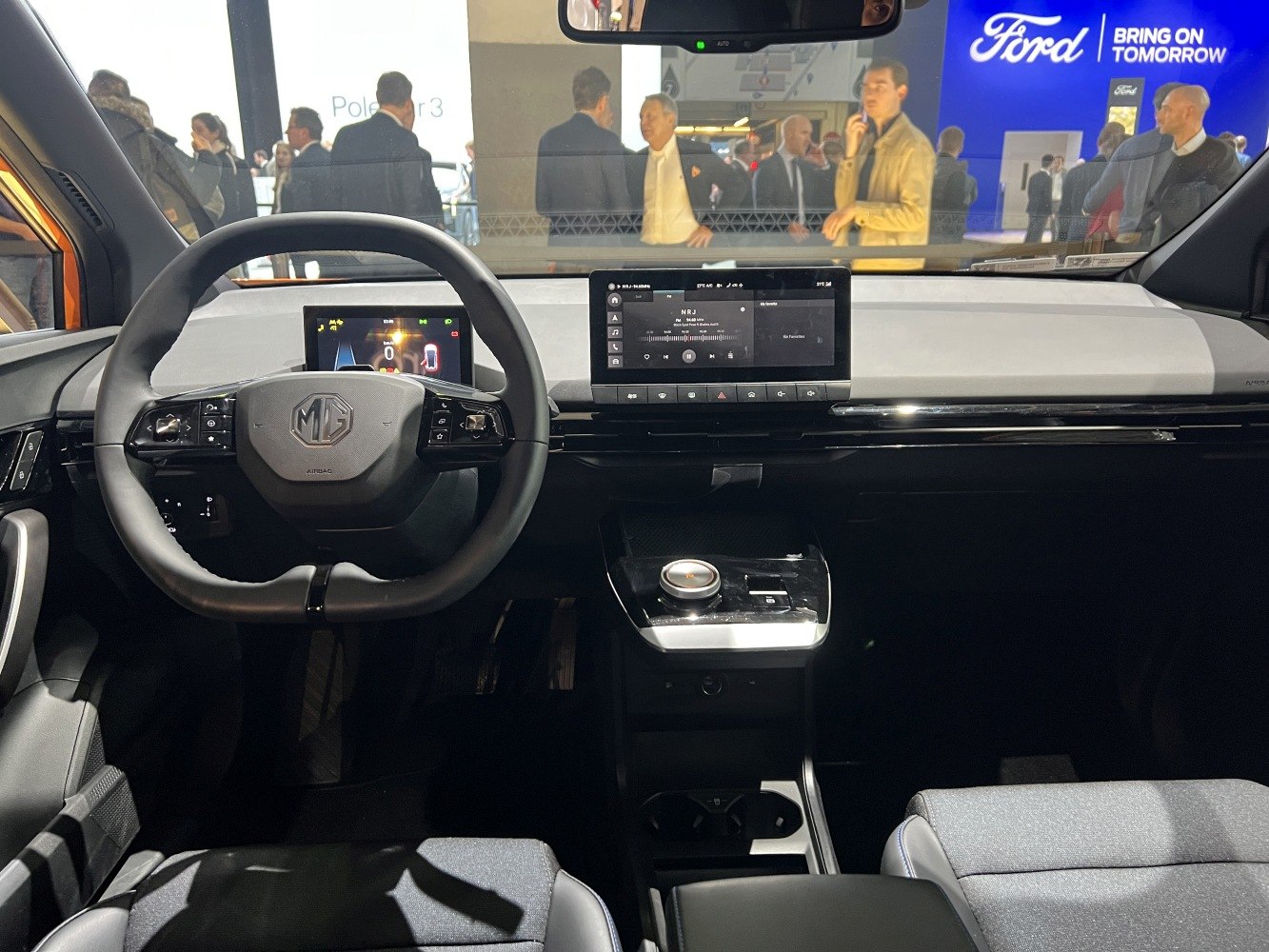 Digital instrument cluster and central touchscreen with modern steering wheel controls