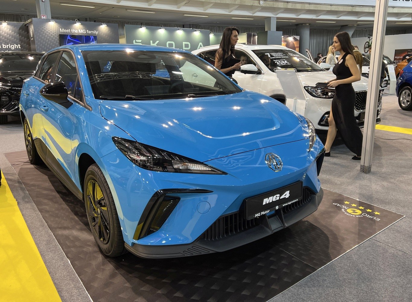 Bright blue electric hatchback front with sleek headlights