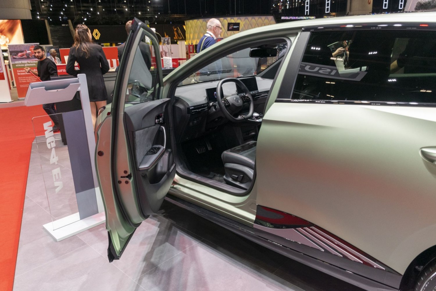 Open driver door showing modern dashboard and interior seating