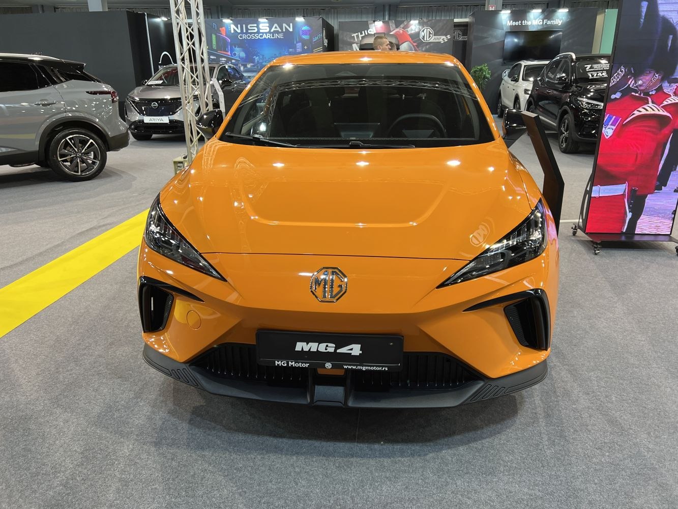 Sharp LED headlights and aerodynamic front bumper in bright orange finish