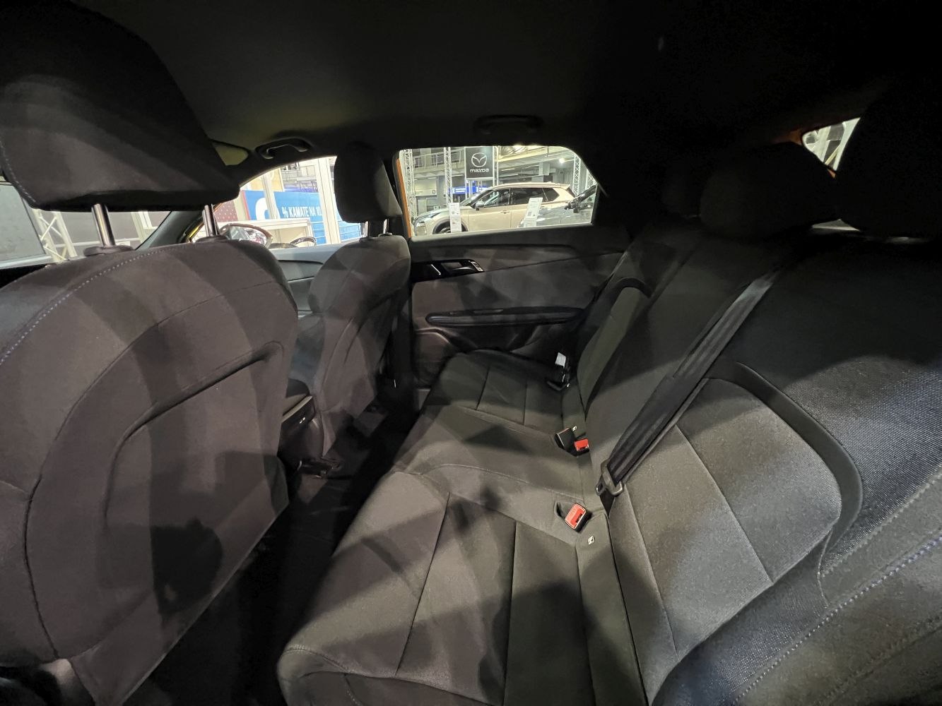 Rear seat interior with black fabric upholstery and spacious layout