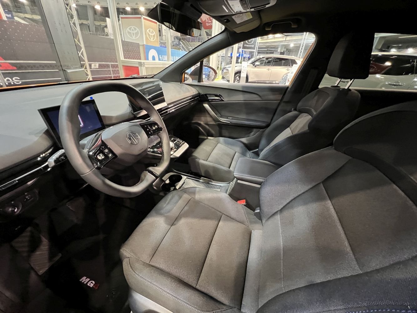 Digital displays, ergonomic seats, modern dashboard layout.