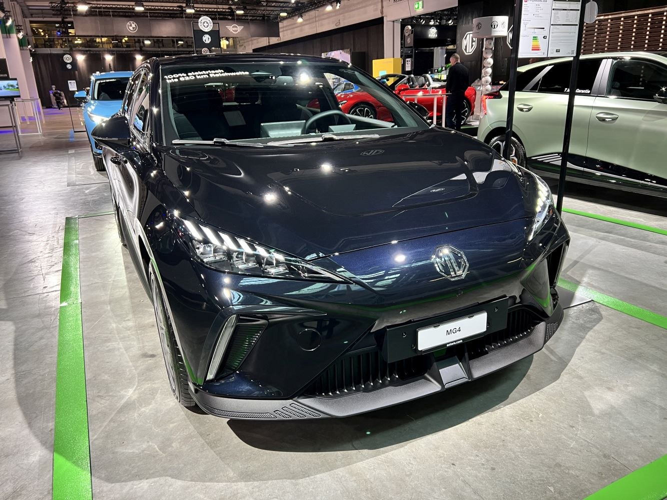 Front view of electric hatchback with sleek headlights and grille