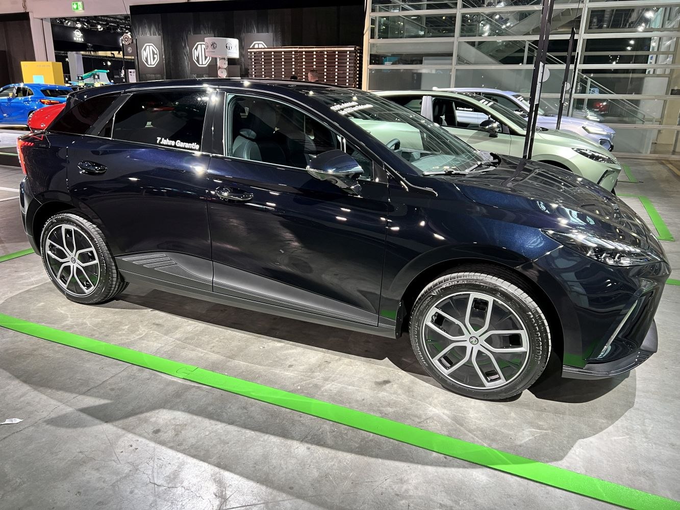 Side profile and alloy wheels of an electric hatchback.