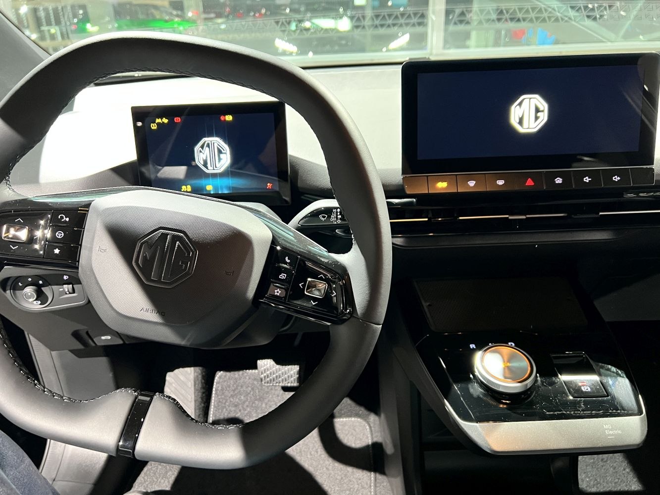 Digital instrument cluster and touchscreen infotainment with modern steering wheel.