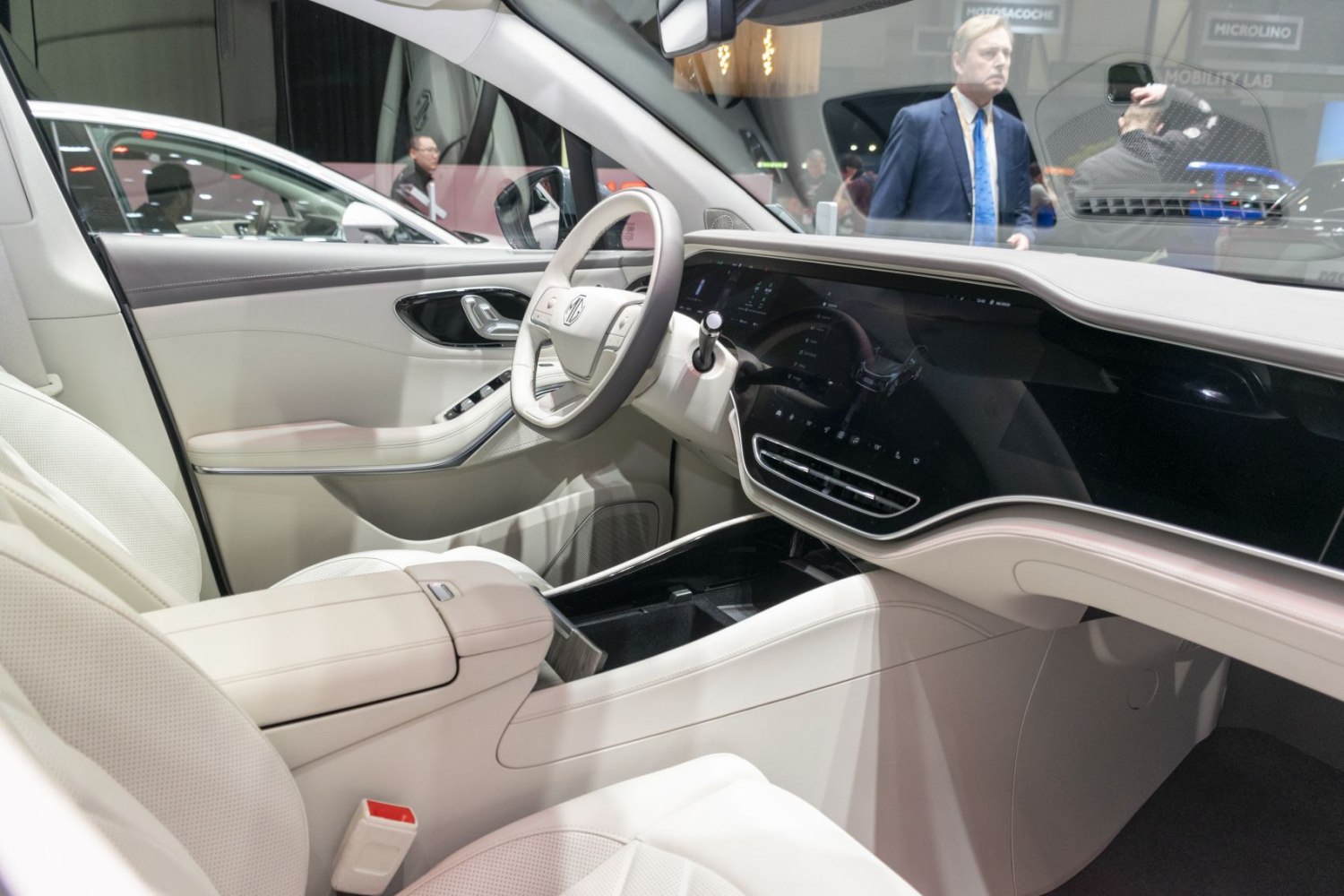 Digital dashboard and white leather luxury seats