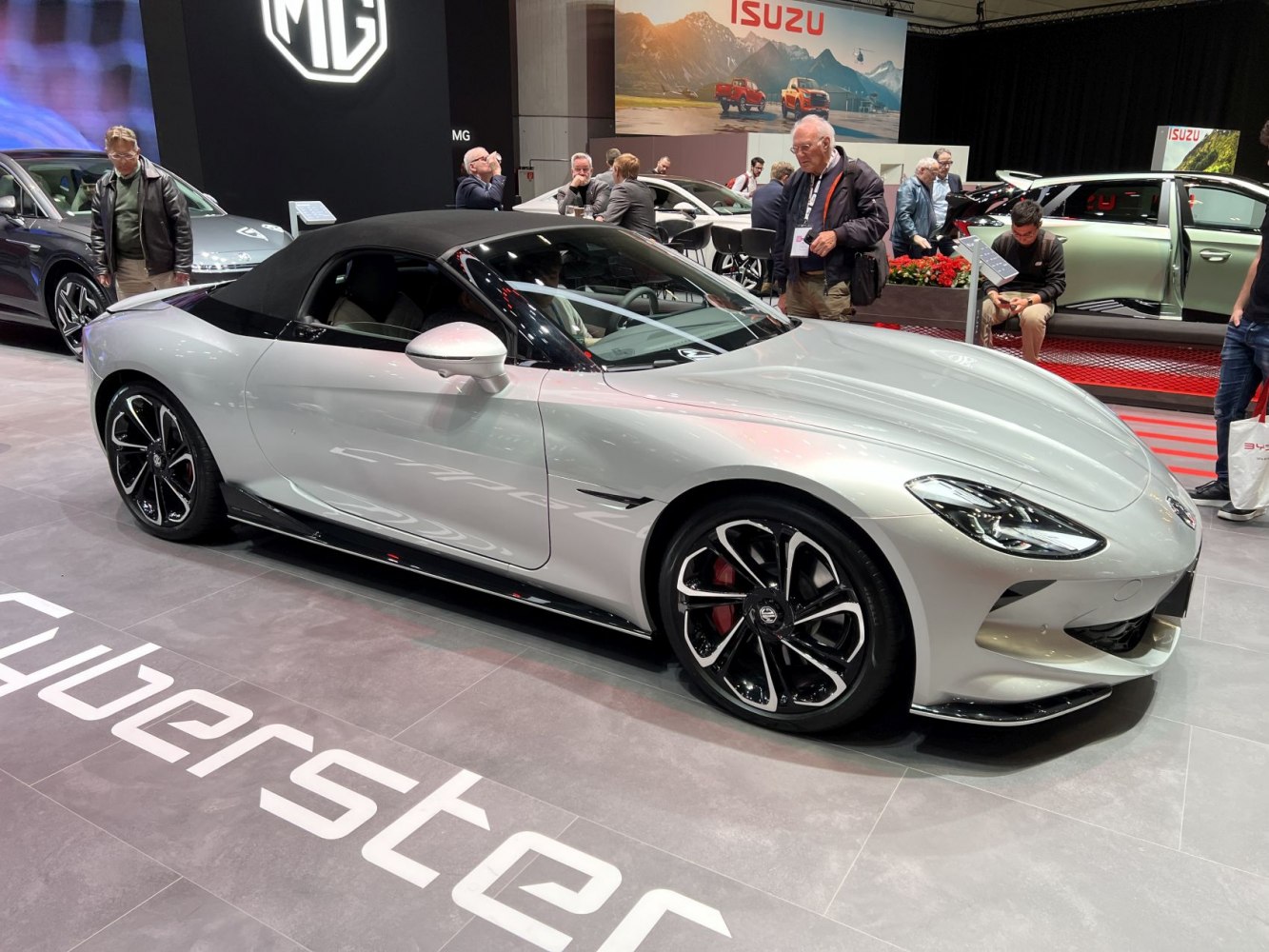Sleek convertible sports car with aerodynamic front and distinctive alloy wheels