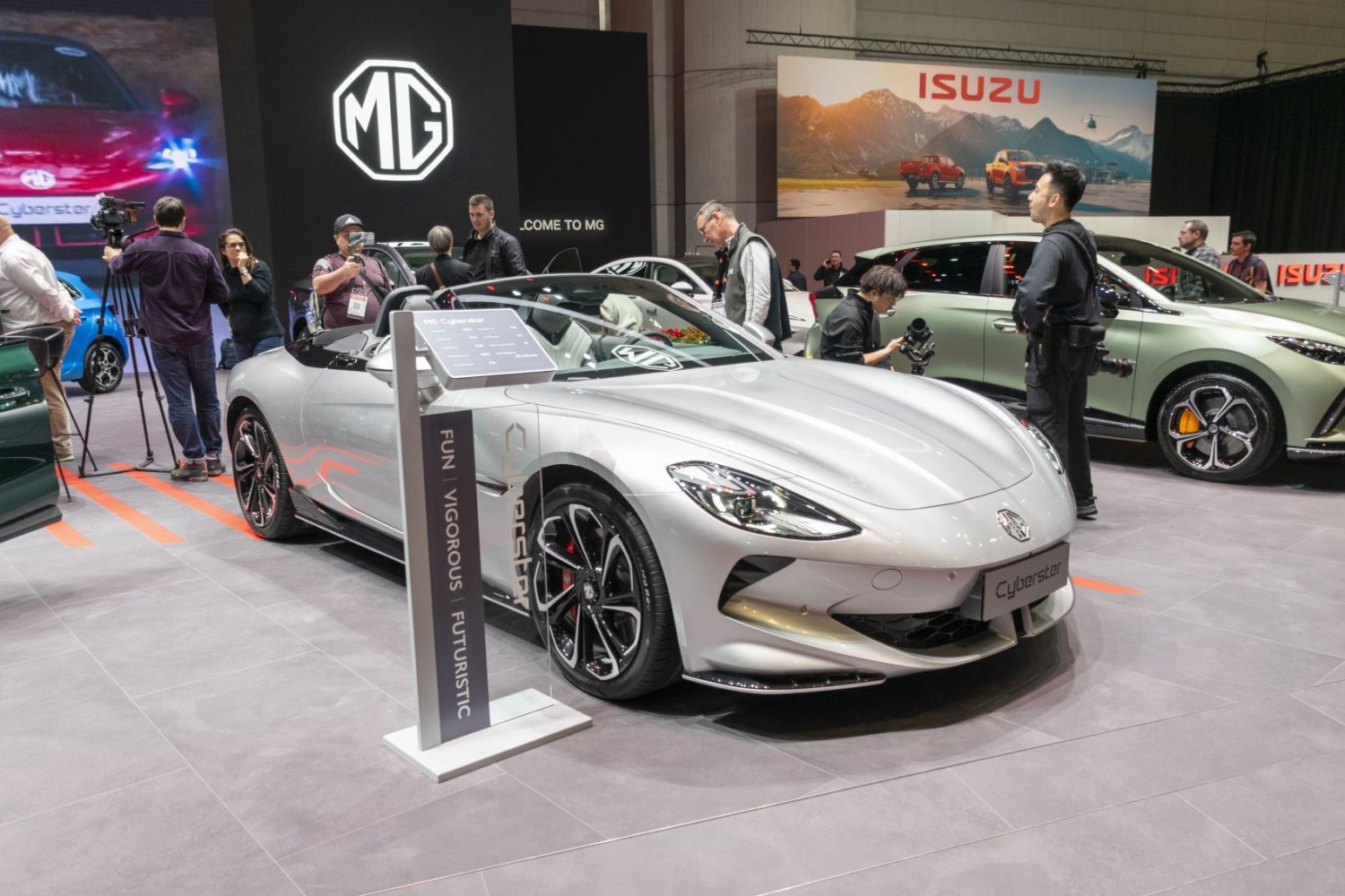 Convertible sports car front view with sleek headlights and alloy wheels