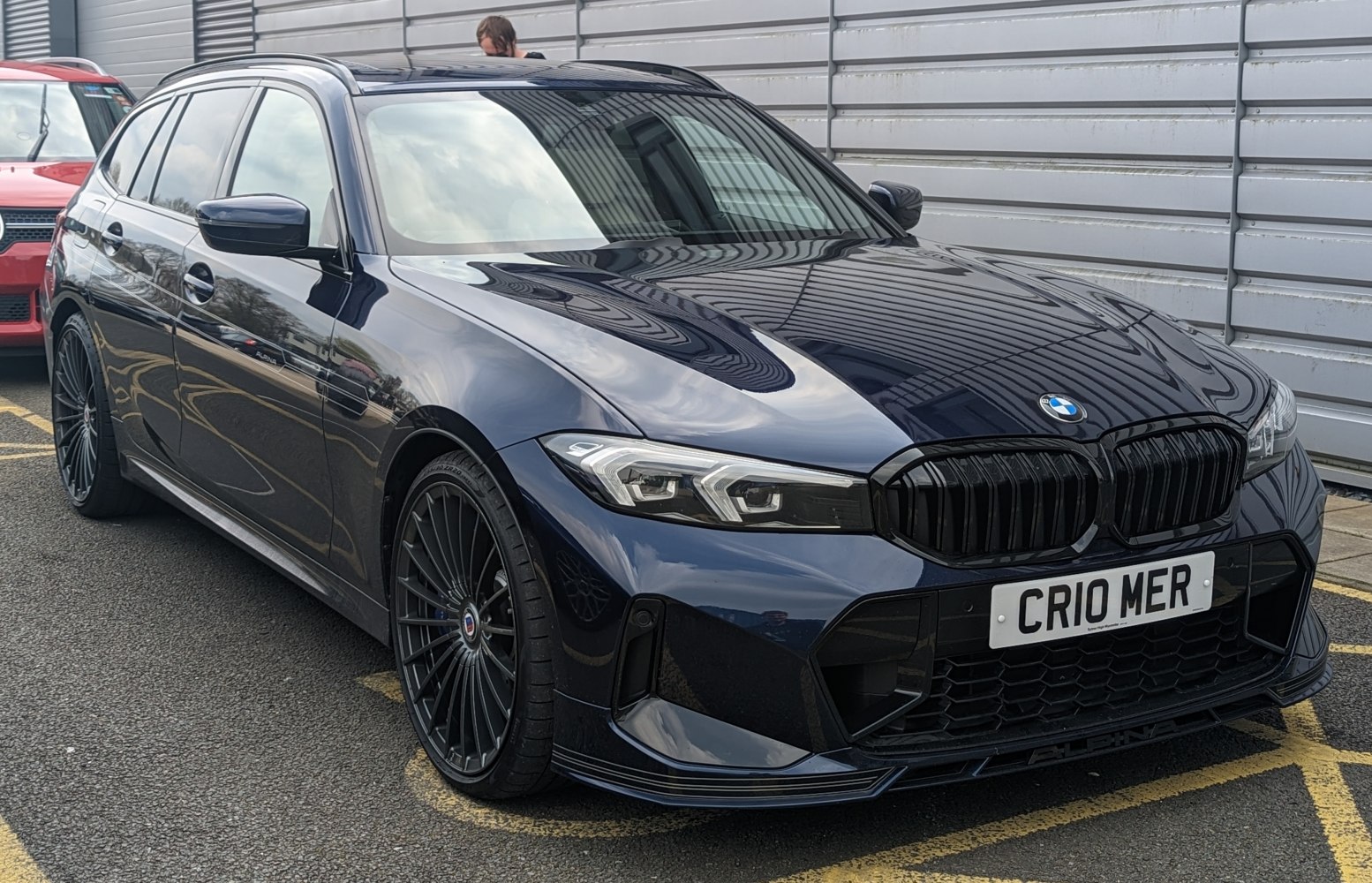 Sleek front and side view with distinctive headlights and sporty wheels