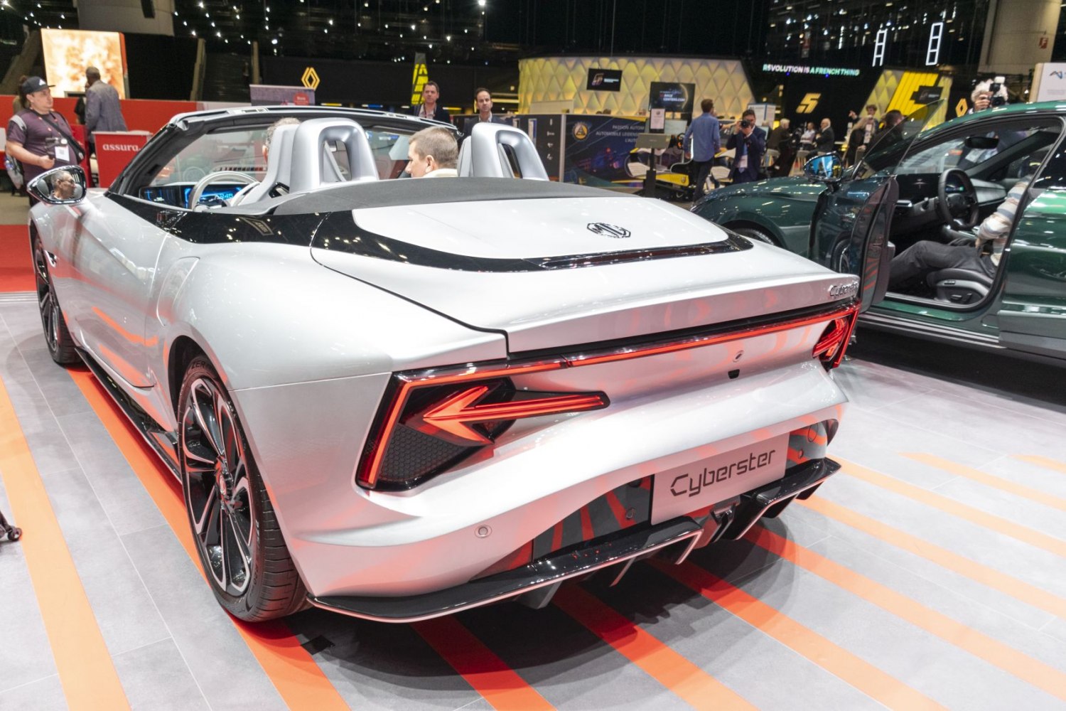 Rear view of sporty convertible with LED tail lights and dual exhausts