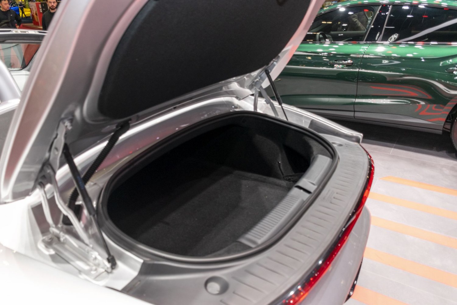 Open car trunk with spacious rear storage and trunk lid mechanism