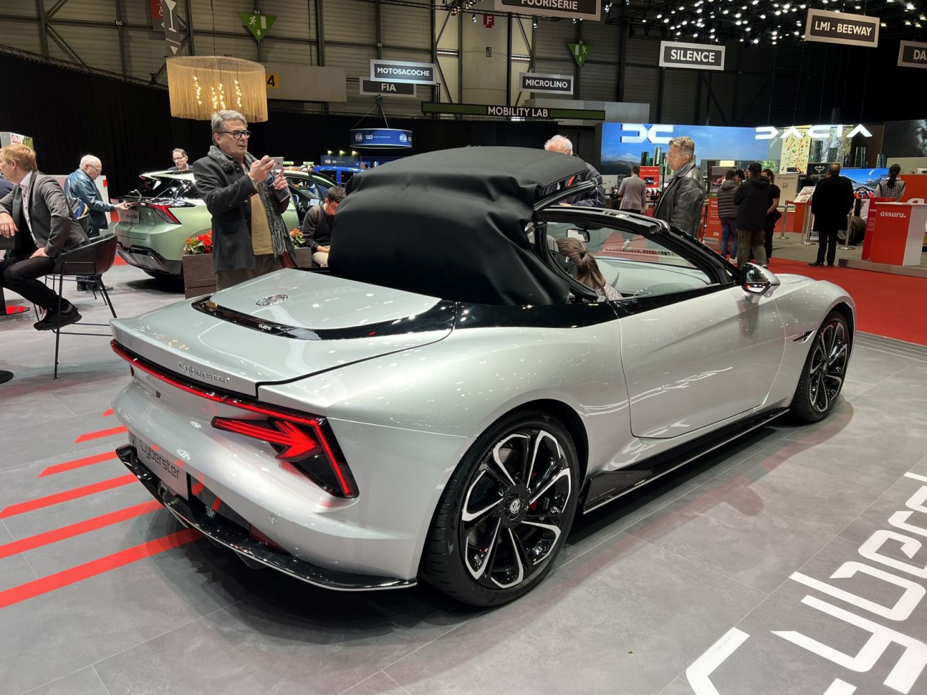 Convertible sports car with soft top roof and distinctive rear LED lighting