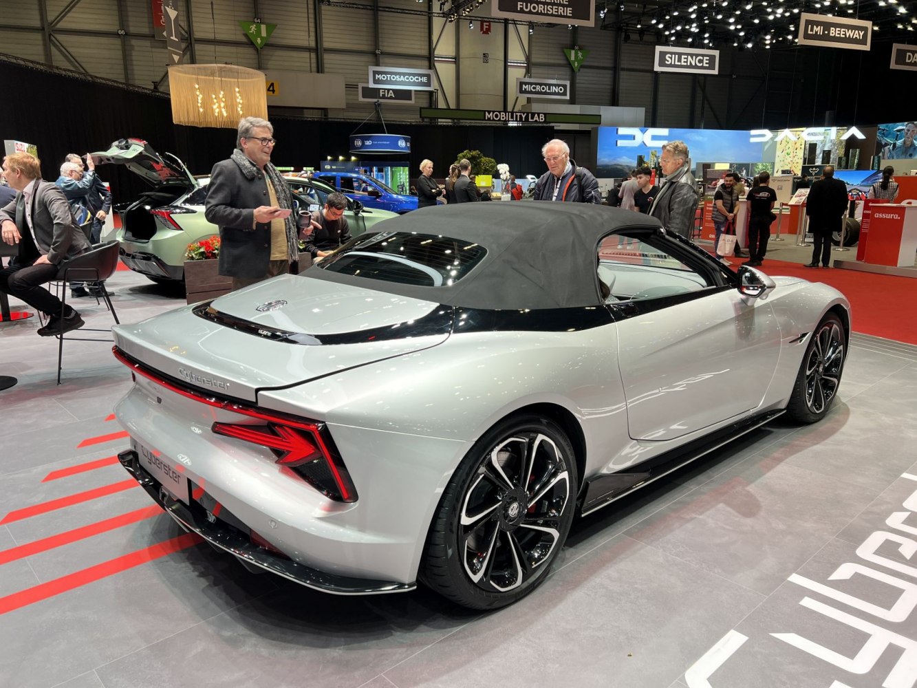 Convertible coupe with sleek rear design and black soft-top roof