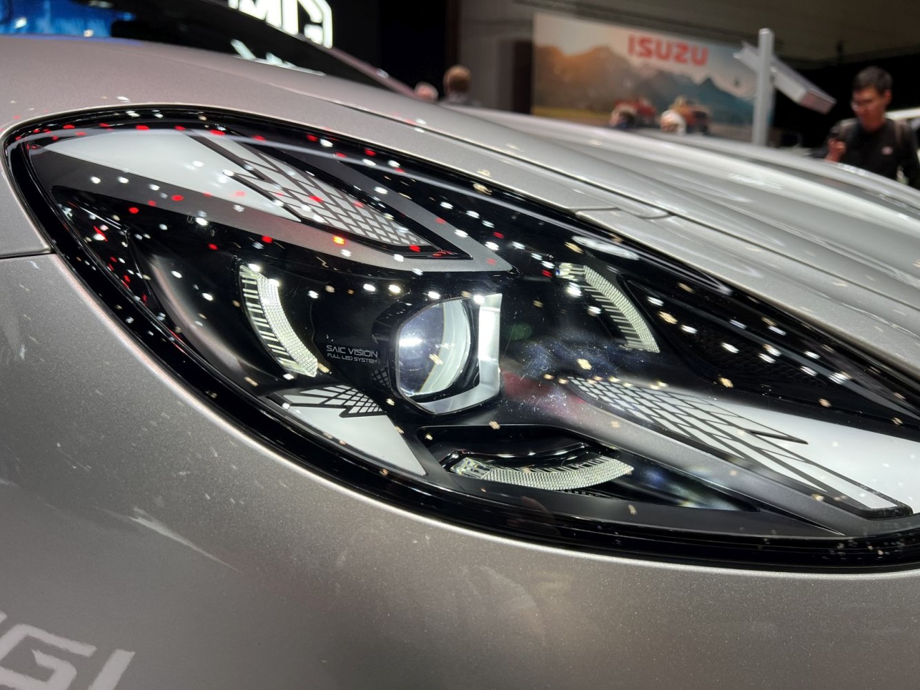 Close-up of modern full LED headlight with intricate design and lighting elements