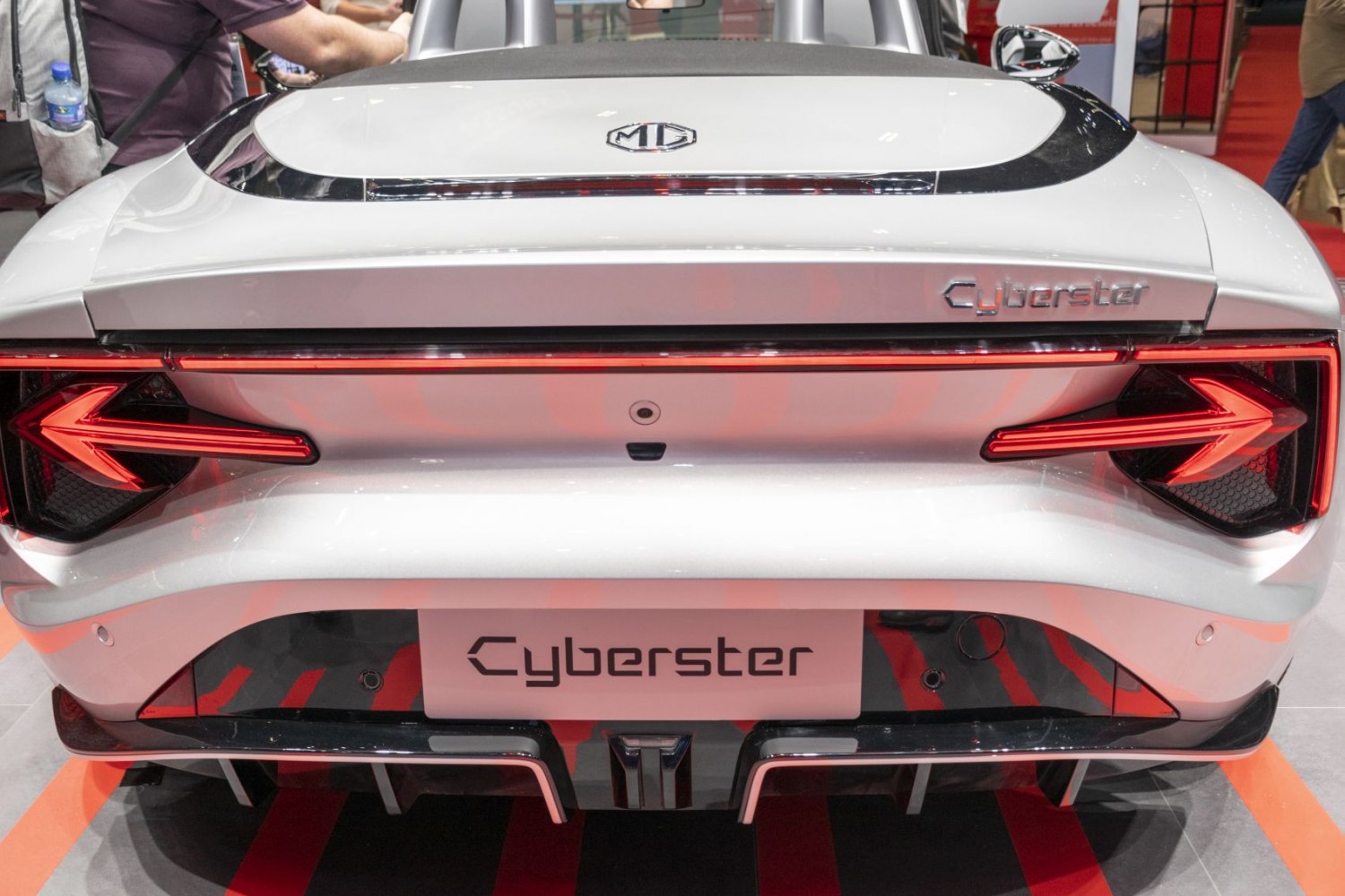 Rear view with distinctive LED arrow-shaped taillights and aerodynamic design.