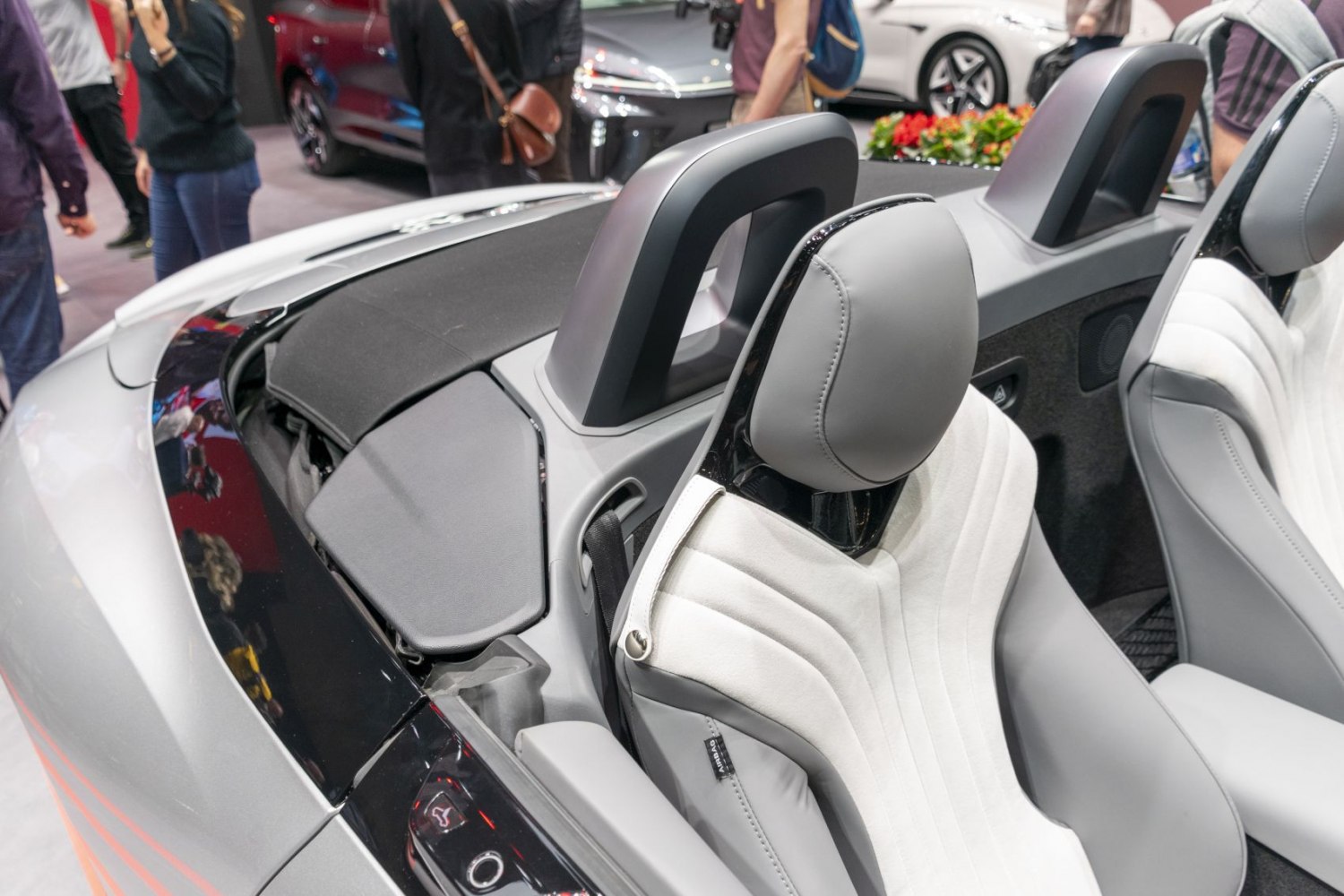 Close-up of sports seats with unique headrests and integrated roll bars.