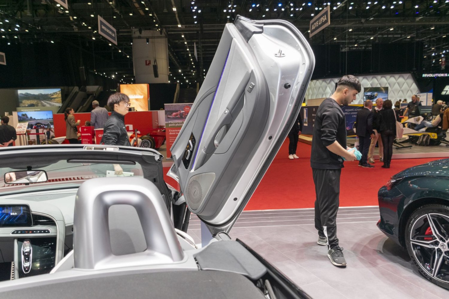 Gullwing door interior and dashboard details with speaker and controls.