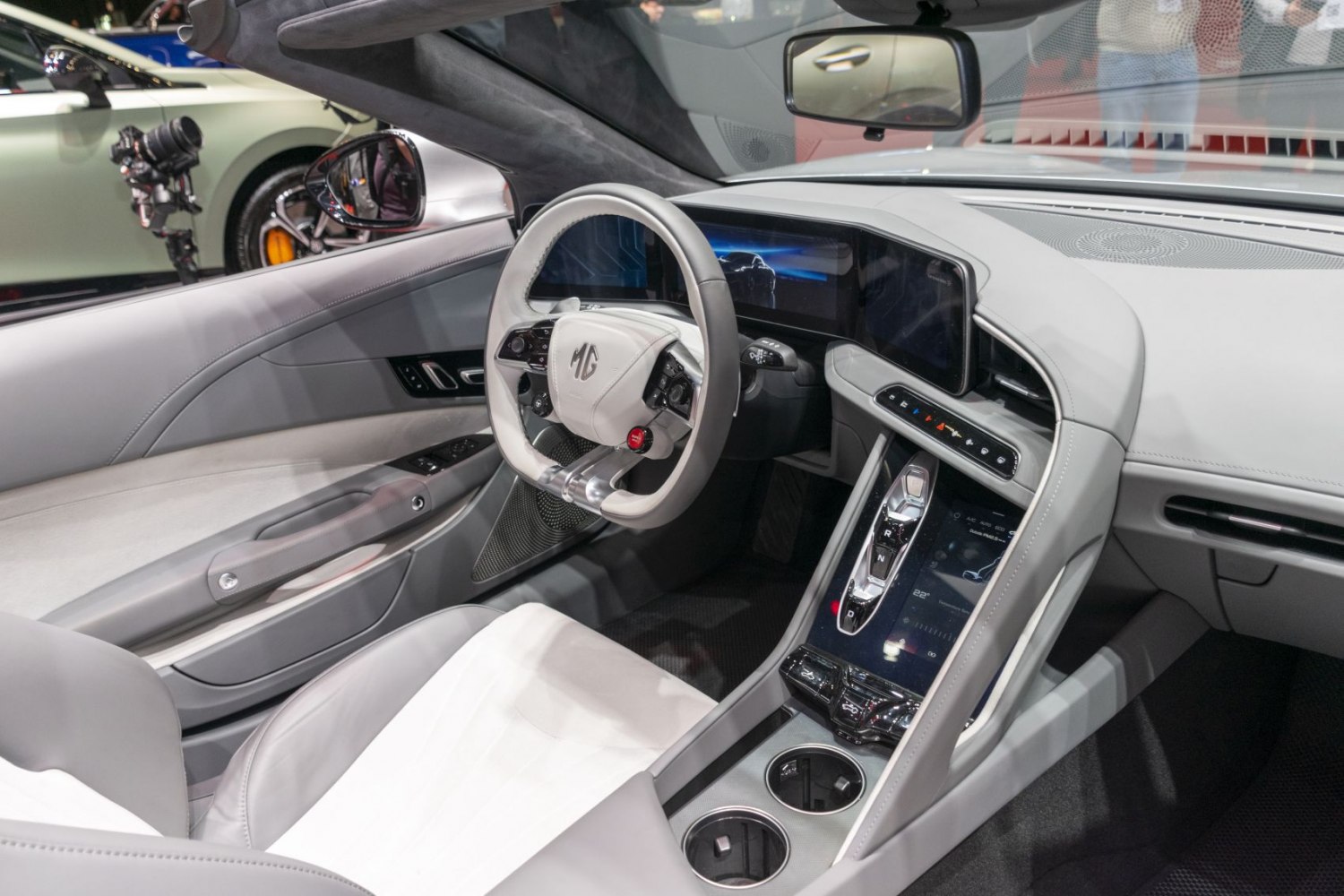 Modern car interior with digital dashboard and unique steering wheel design