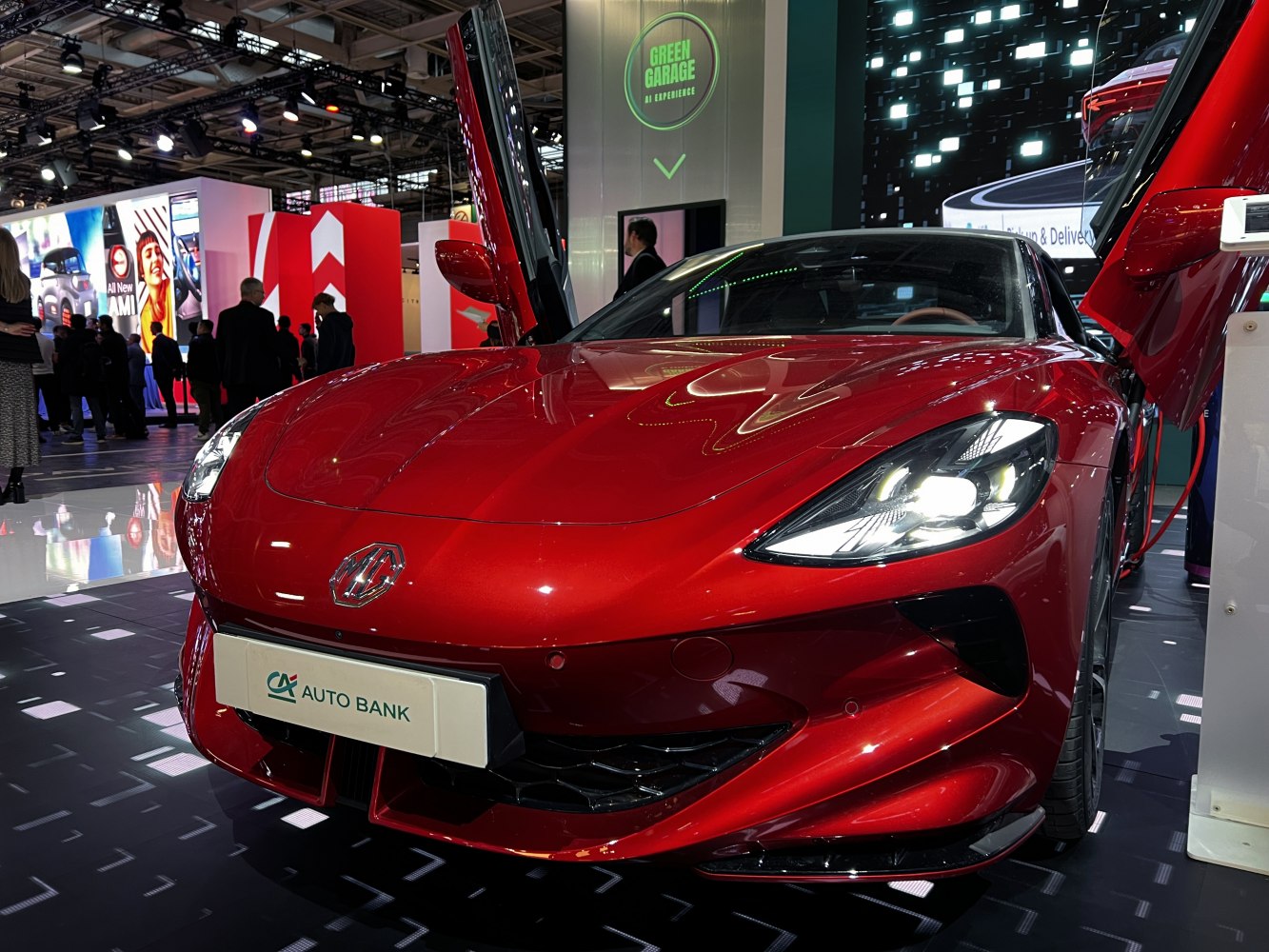 Red sports car with butterfly doors and sharp LED headlights