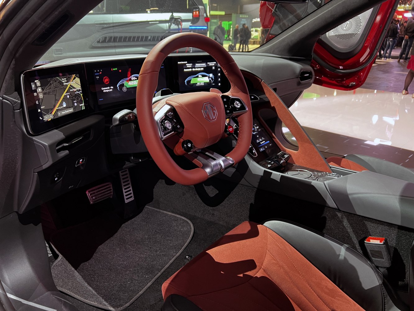 Dual digital screens, modern steering wheel, premium upholstery