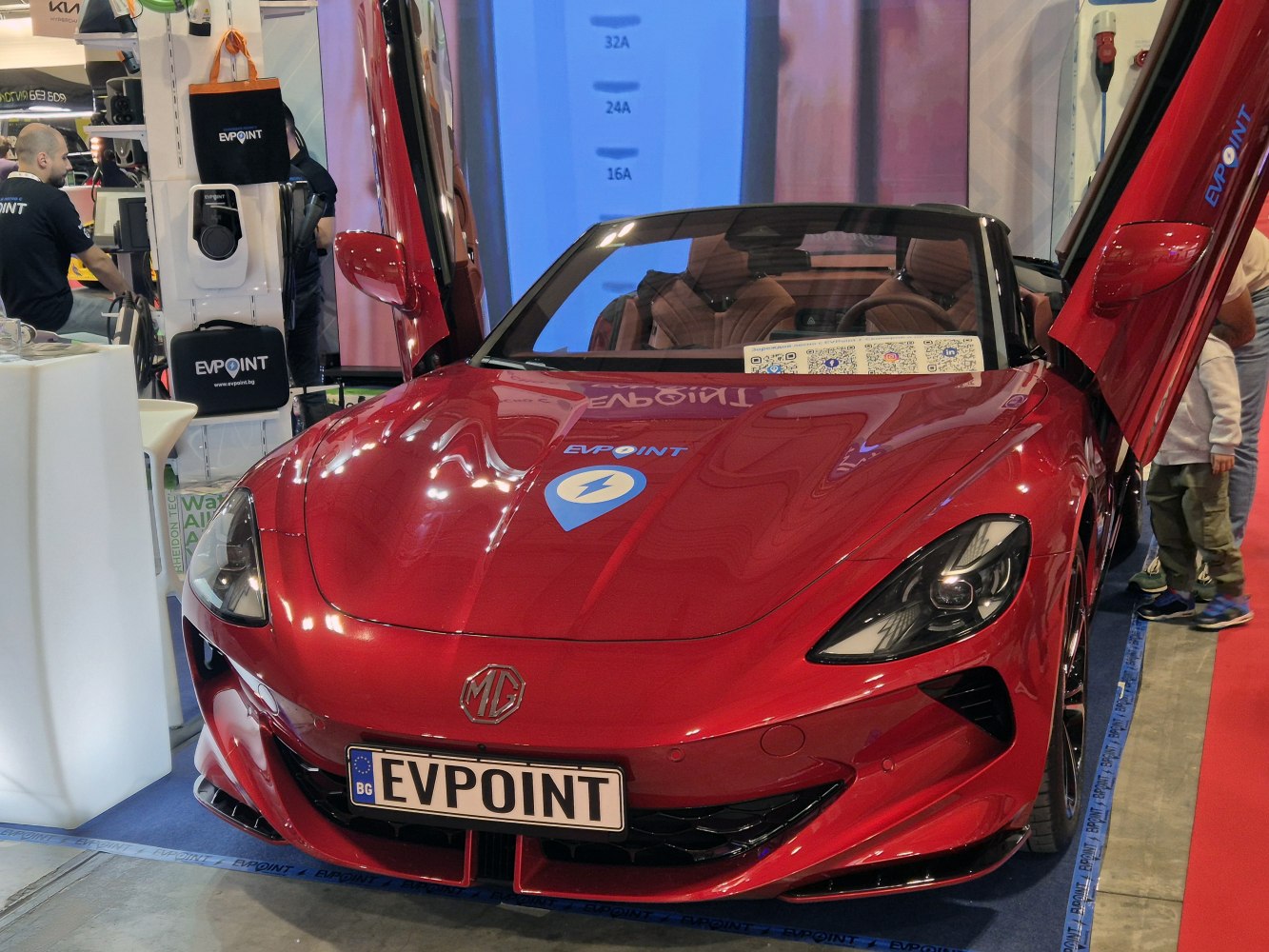 Electric roadster with distinctive scissor doors and sleek sportscar design