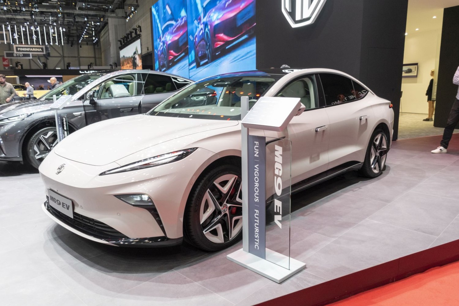 Sleek electric sedan with aerodynamic LED headlights and futuristic alloy wheels.