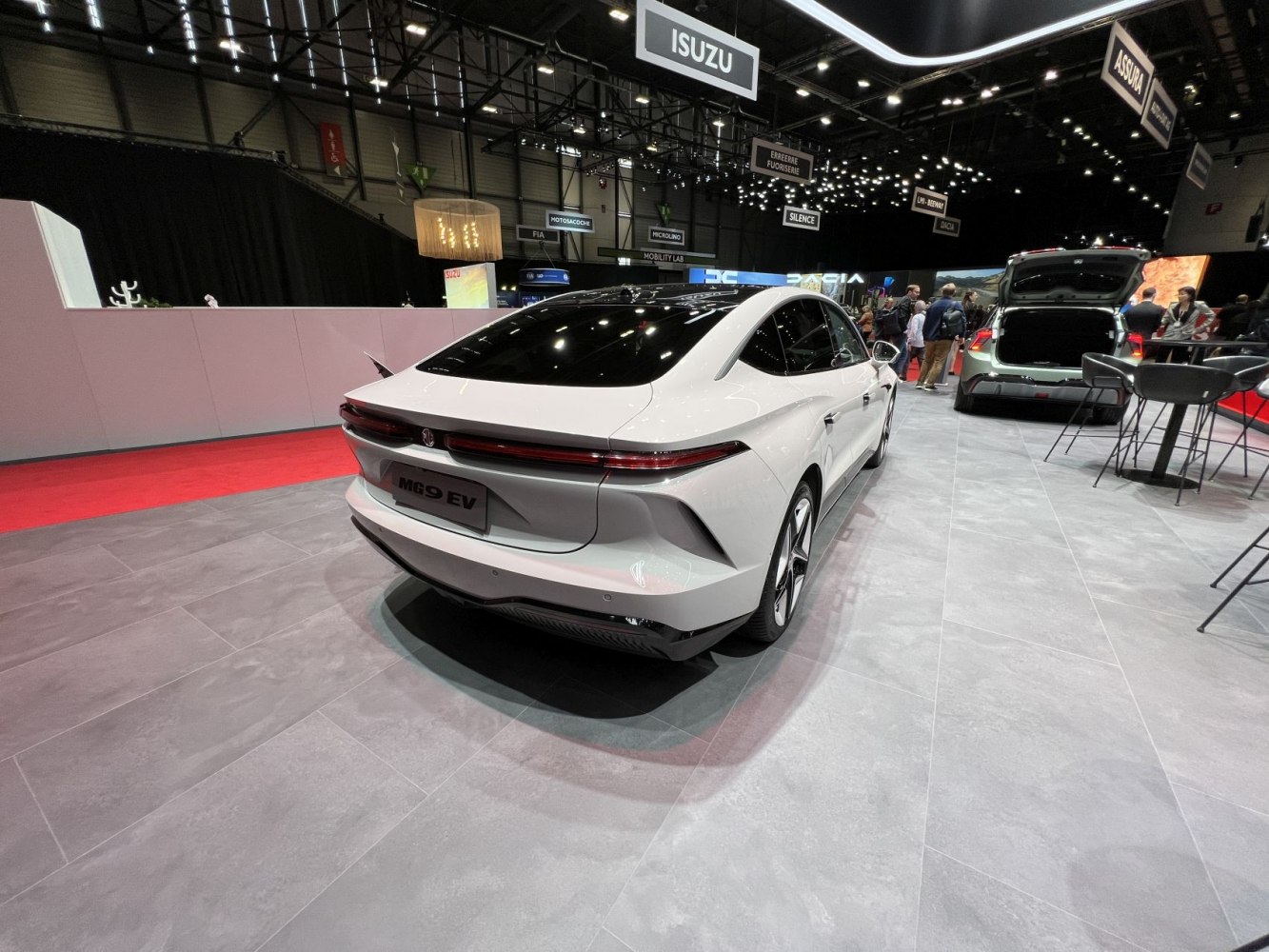 Rear view of sleek electric luxury sedan with modern lighting.