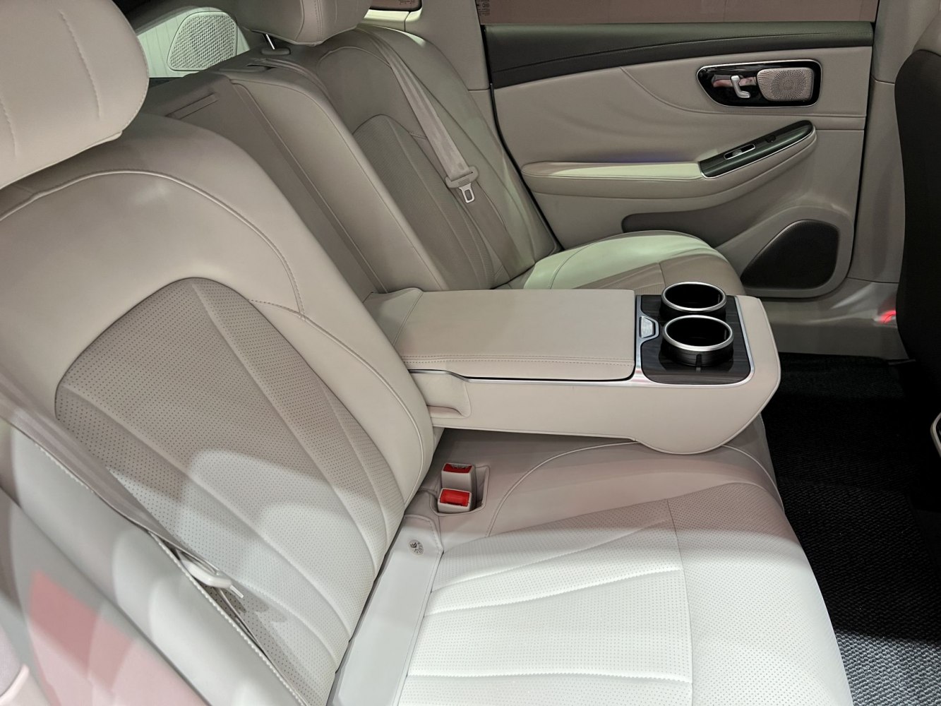 Leather rear seats with center armrest and dual cup holders
