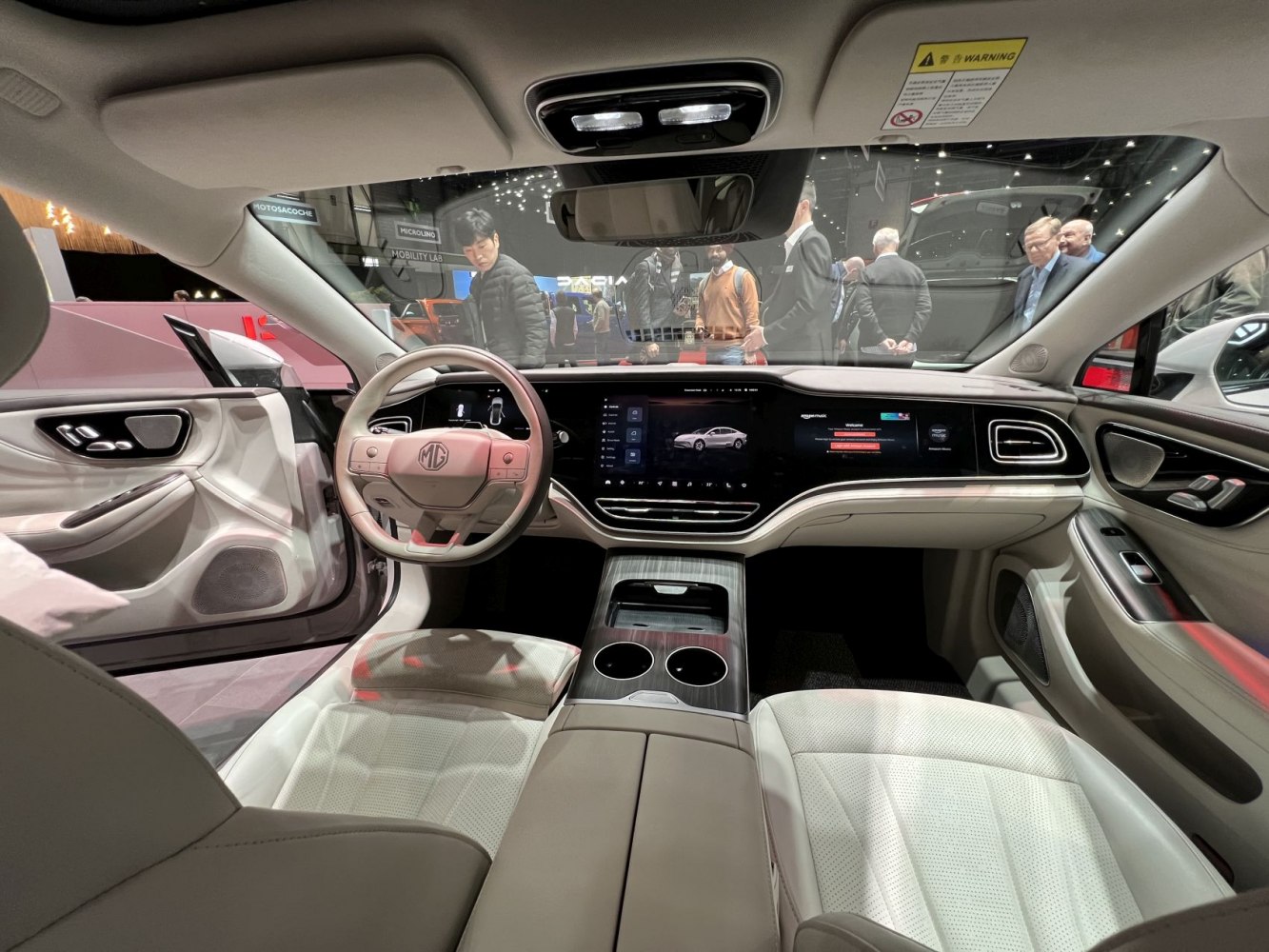 Digital dashboard and luxury light-colored seats in EV interior