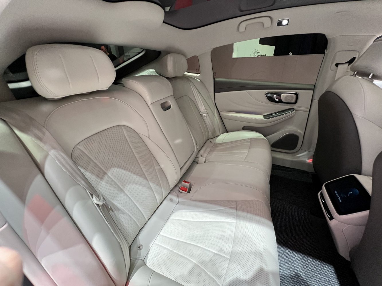 Luxurious leather rear seats with modern design and spacious cabin.