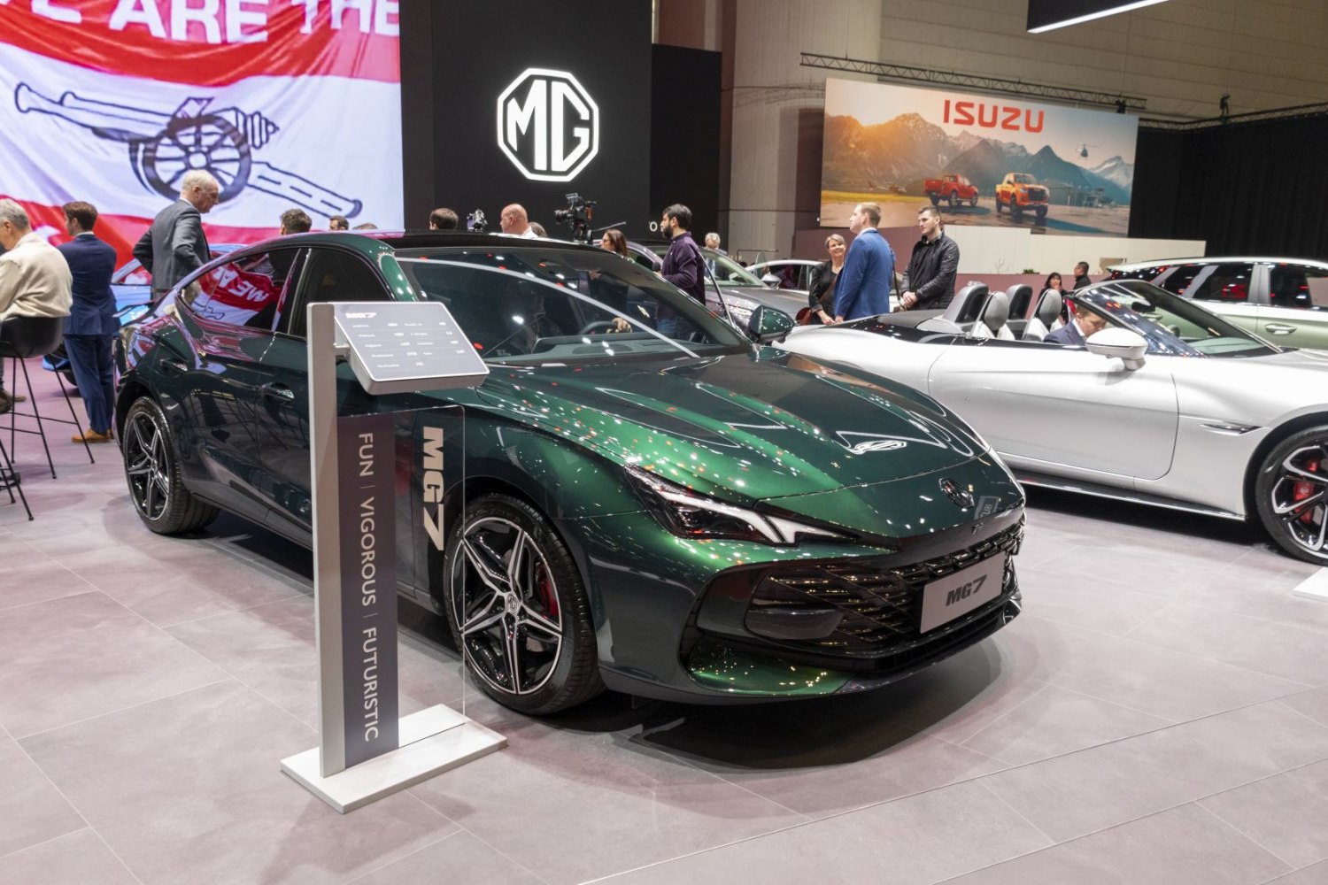Dark green sedan with LED headlights and sporty alloy wheels