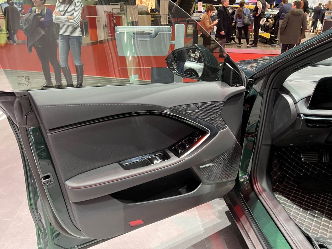 Modern car interior door panel with control buttons and sleek design
