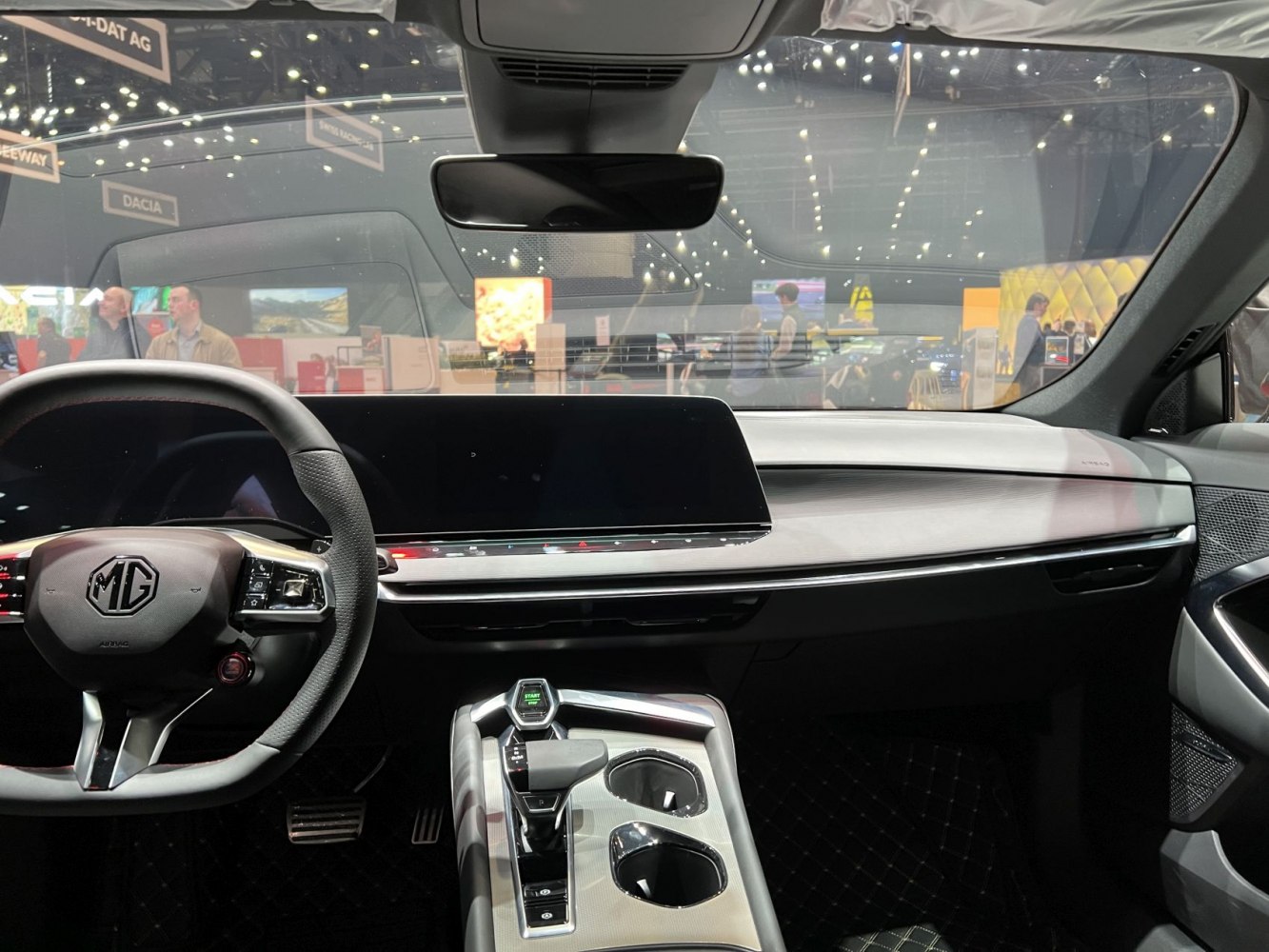 Digital dashboard, large touchscreen, modern center console and steering wheel