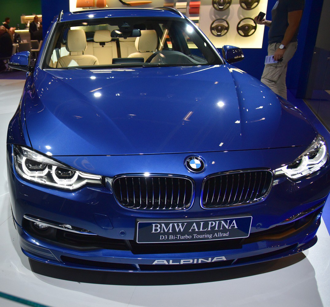 Front view with LED headlights and kidney grille of a luxury touring vehicle