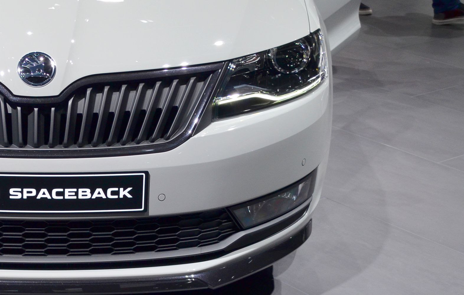 Close-up of front grille and headlight with LED daytime running light