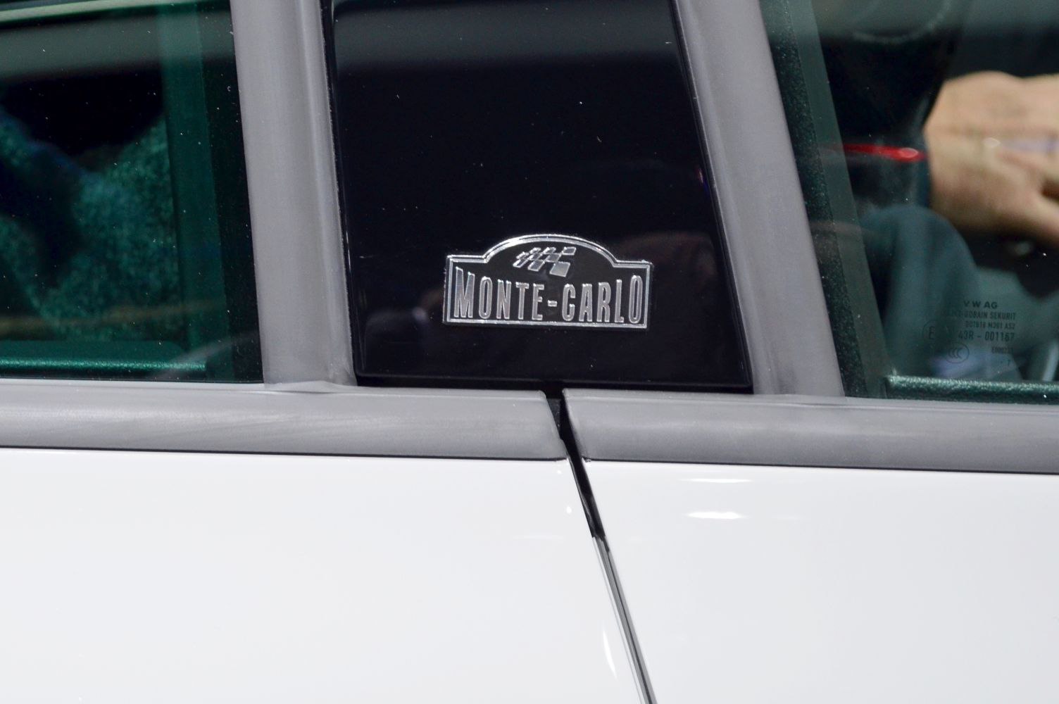 Monte-Carlo badge on car pillar window trim
