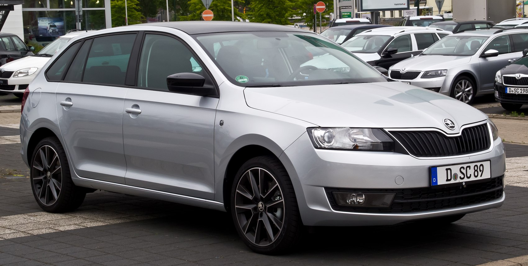 Silver hatchback with black grille and alloy wheels