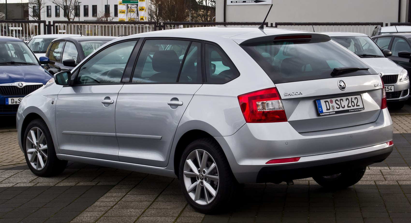Silver 5-door hatchback rear view with alloy wheels and distinct taillights