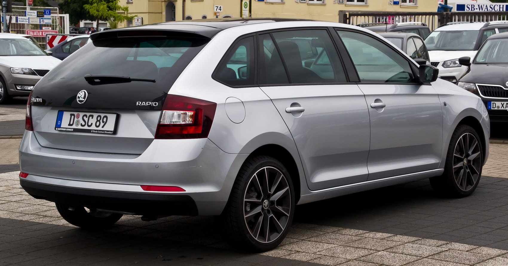 Rear view of a hatchback with distinctive taillights and alloy wheels