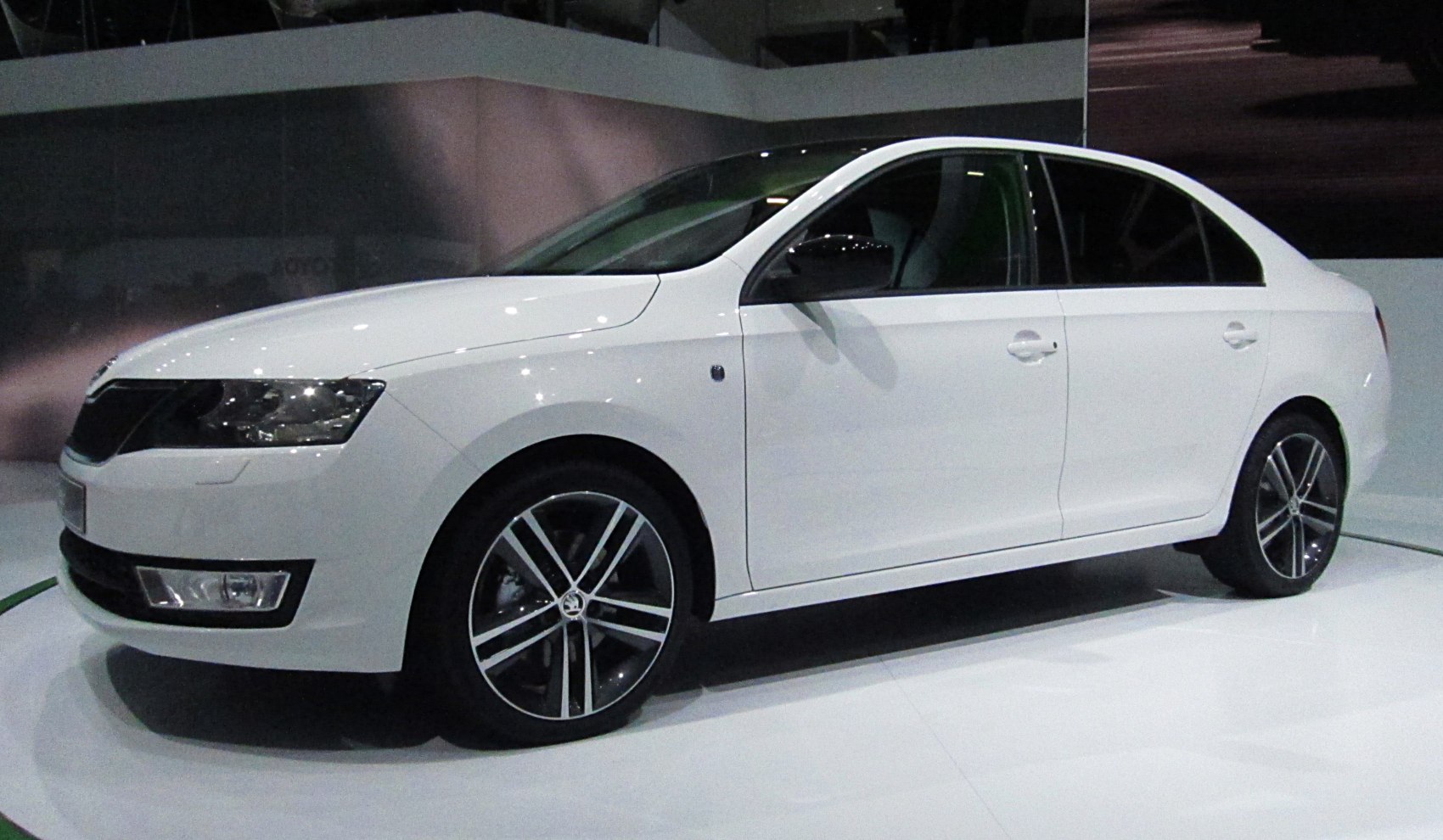 Front and side view of sedan with alloy wheels